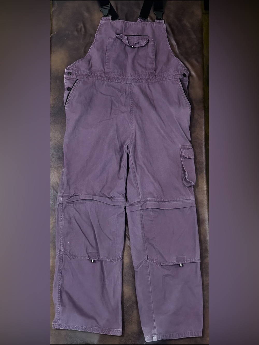 #F-05 ROSIES Women’s Purple Utility Overalls Jumpsuit, with zippers at knees.